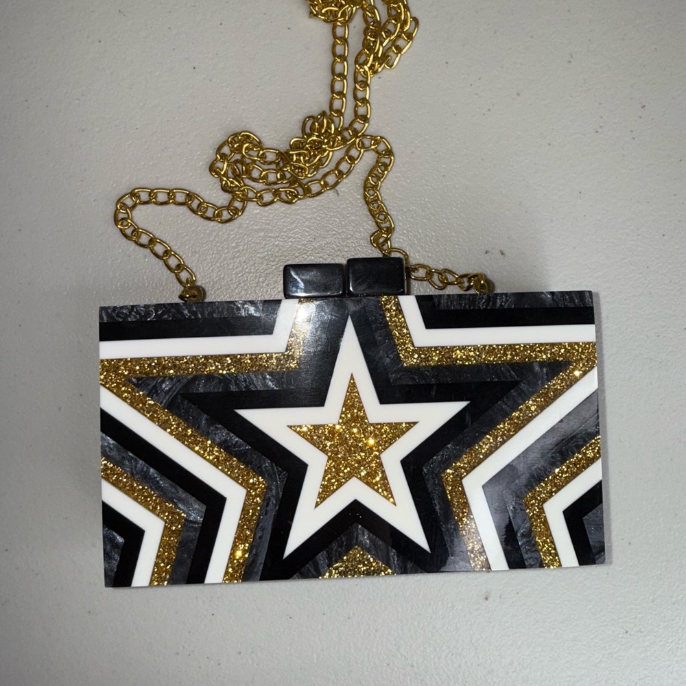 Black and gold star clutch bag